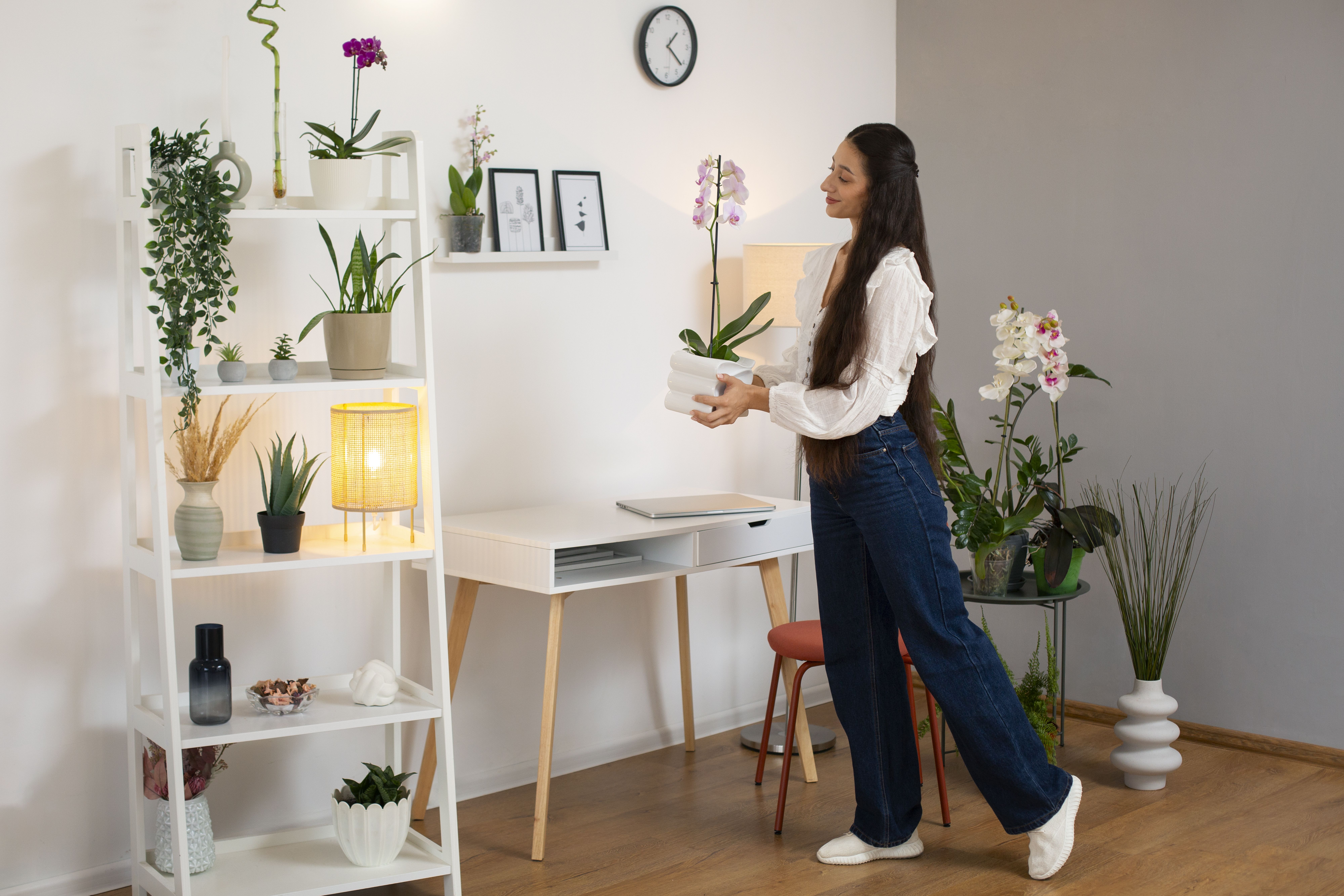 view woman decorating her home with orchid flower